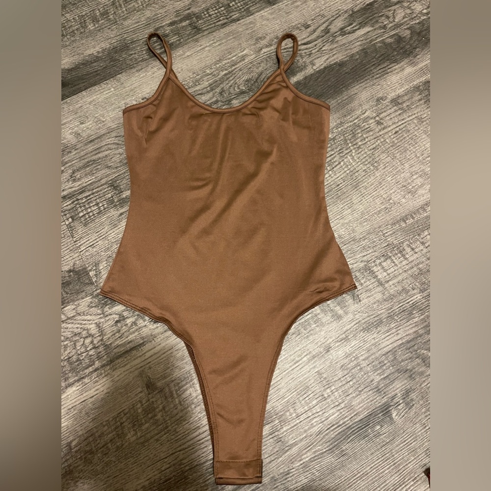Brown body suit